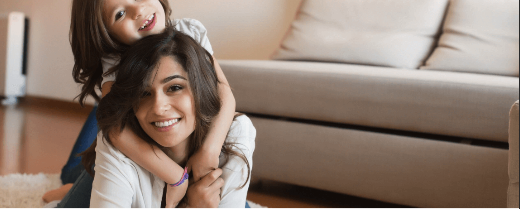 Mother and daughter smiling together